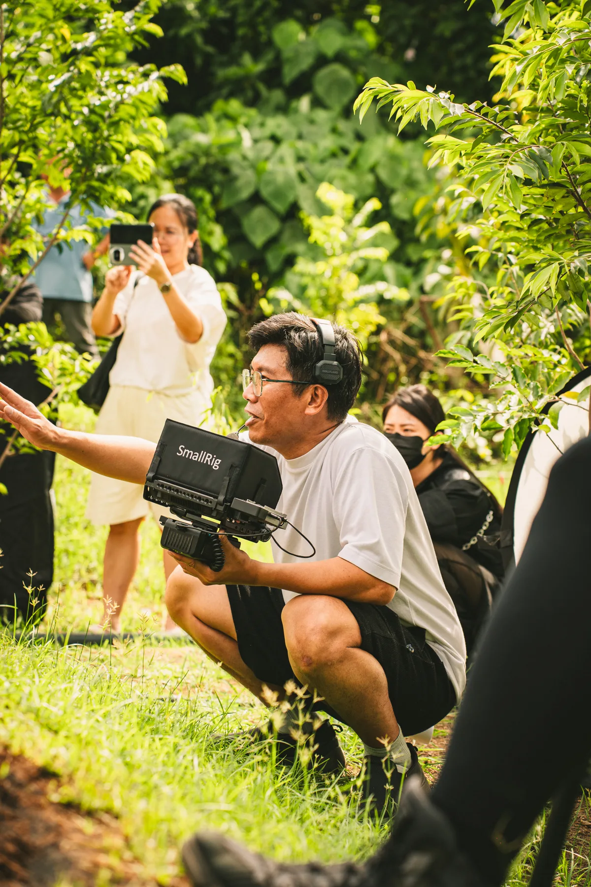 Travis Lam, founder of T Movement Studio, directing a video shoot on location